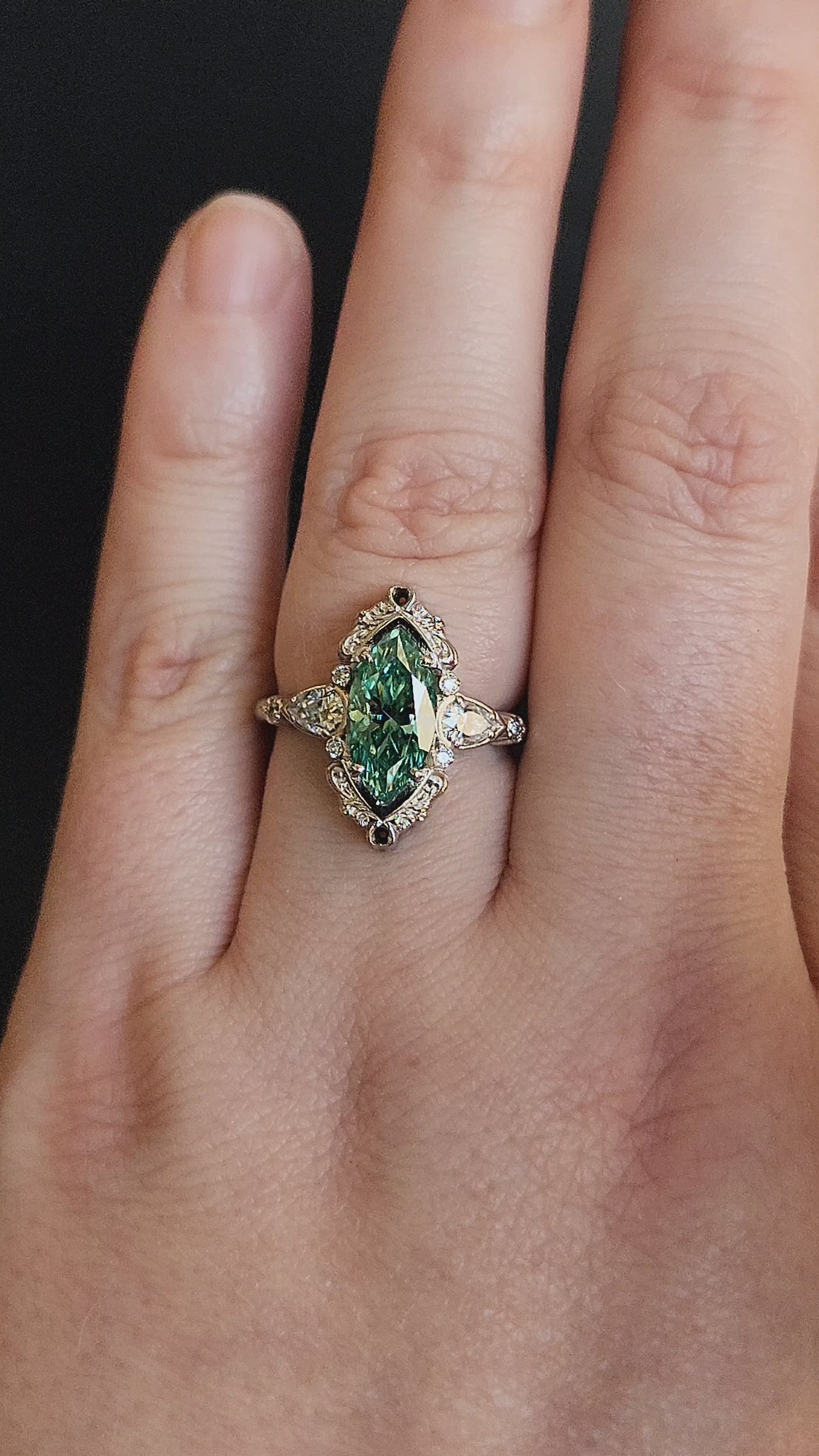 Load and play video in Gallery viewer, Limited Edition LAST ONE - Green Moissanite Odette Marquise Engagement Ring with Pear Side Stones and Gold Scrollwork - Fantasy Filigree 14k Gold Handmade Ring
