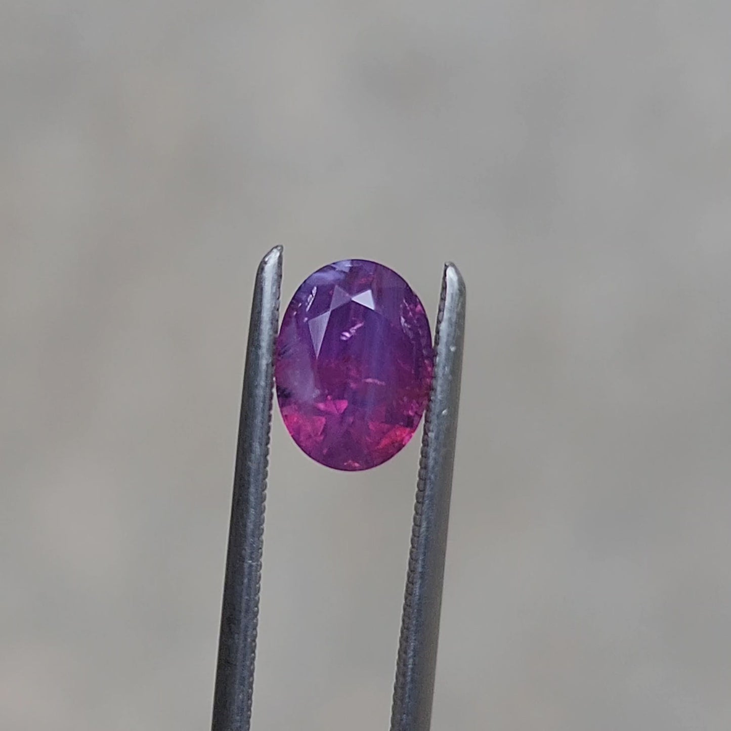 1.64 Natural Opalescent Purple Pink Oval Sapphire