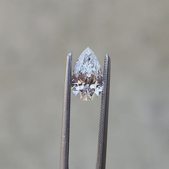Load and play video in Gallery viewer, .80ct Pear Cut Lab Diamond E/VS2
