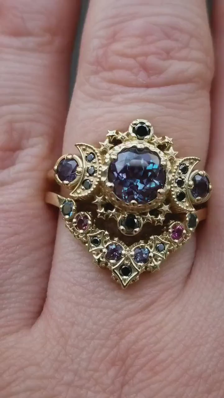 Load and play video in Gallery viewer, Deep Space Chatham Alexandrite and Black Diamond Cosmos Moon and Star Engagement Ring Set with Nebula Stardust Chevron Wedding Band
