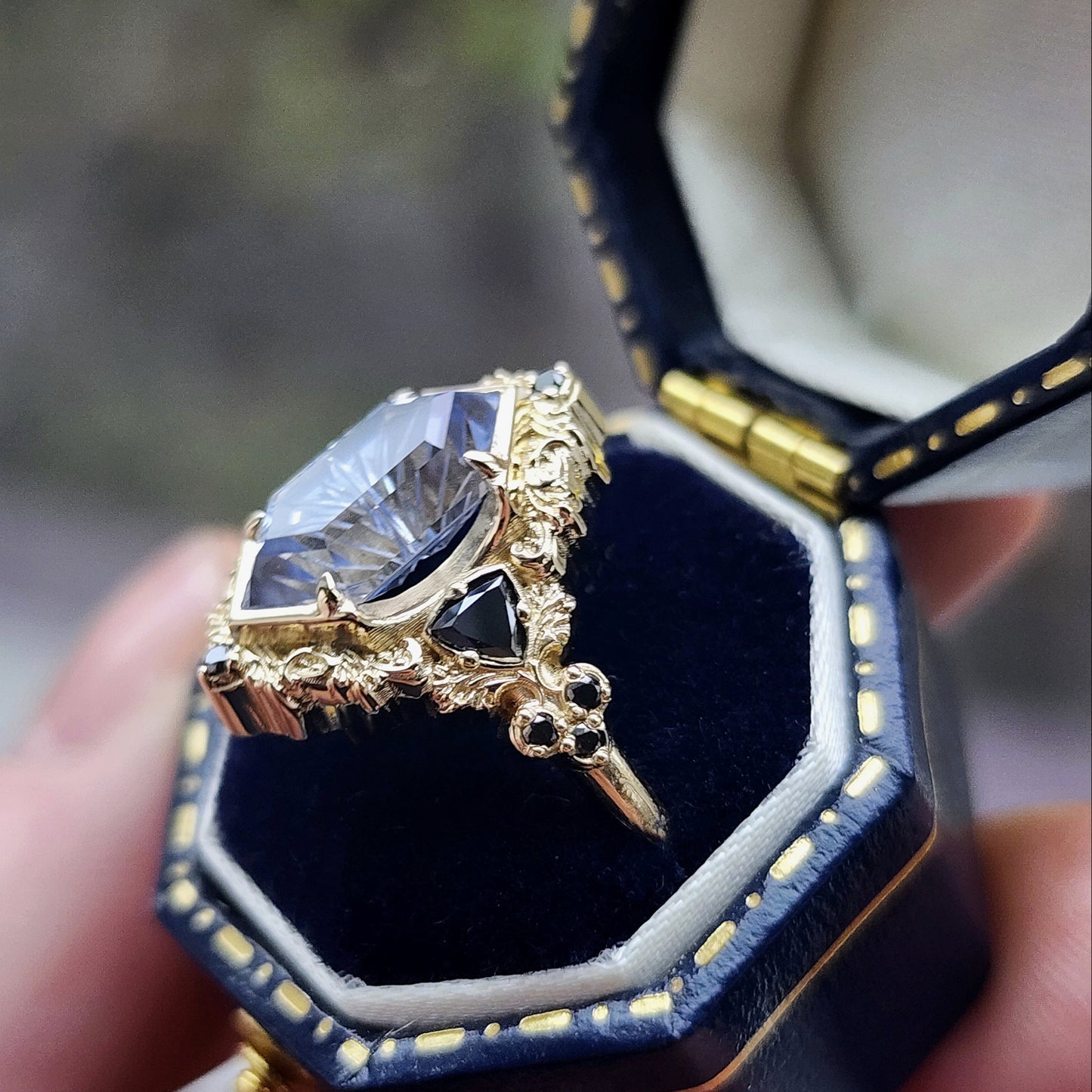 Ophelia/Delilah hybrid ring features a 2.92ct Light Purple Lab Sapphire Duchess Fantasy Cut from Fellowship Forge. The ring is accented with black diamond trillions totaling .18cts and additional black diamond accent stones totaling .07cts Crafted in 14kt yellow gold image 6