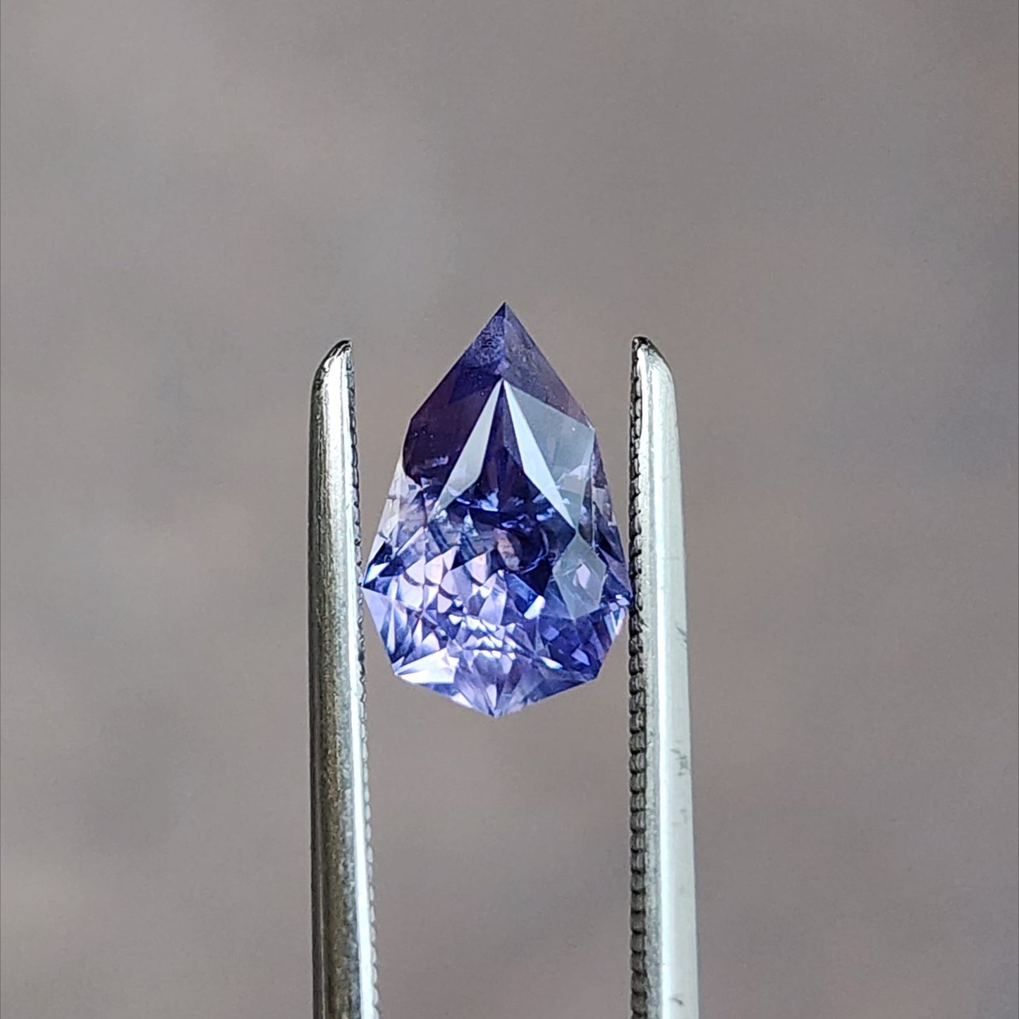 natural geometric step cut purple pear sapphire from Sri Lanka