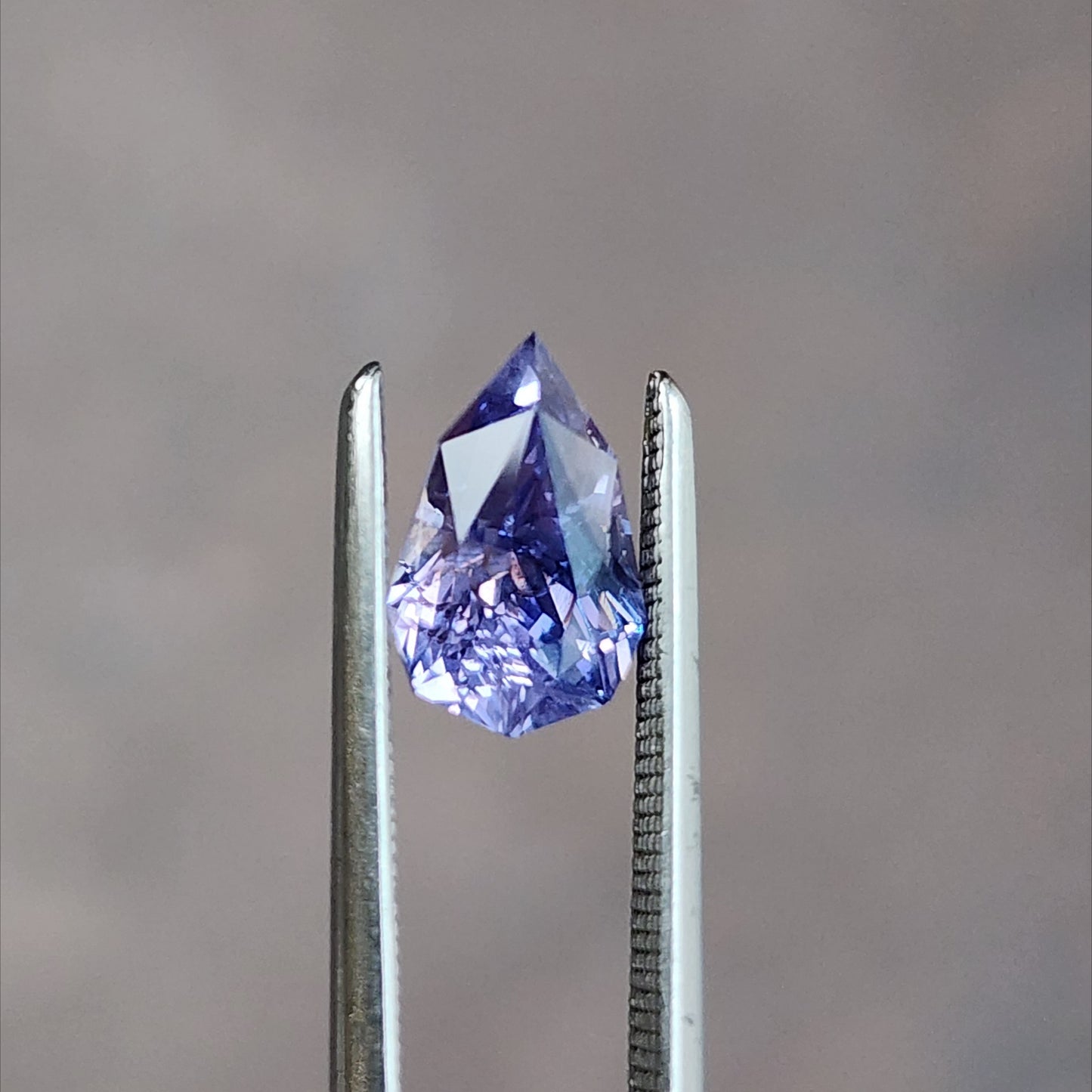 natural geometric step cut purple pear sapphire from Sri Lanka