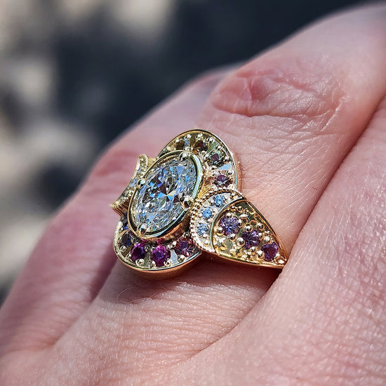 Load image into Gallery viewer, Spectrum Moon Ring with Lab Diamond Oval Natural Rainbow Sapphire Halo and Gold Stardust - Modern Bohemian Eclectic Celestial Engagemet Ring - Pick your Lab Diamond or Moissanite Center Stone
