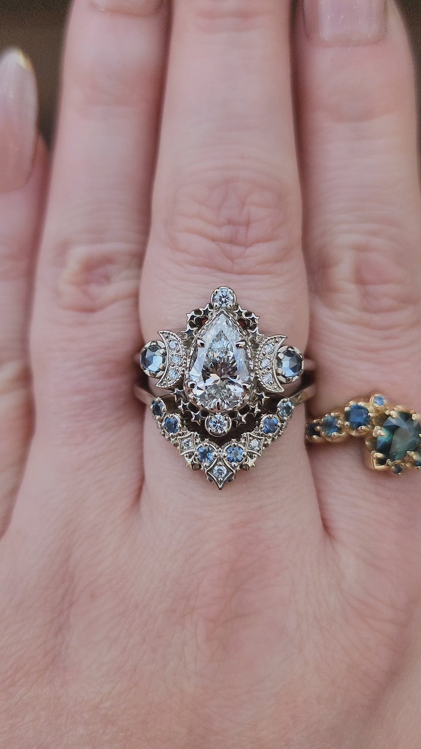 Load and play video in Gallery viewer, 1.67ct Pear Lab Diamond Cosmos Engagement Ring Set with Diamonds and Montana Sapphires - 14k Palladium White Gold video
