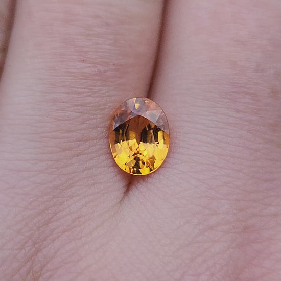 Load and play video in Gallery viewer, 1.69ct Natural Oval Mandarin Garnet

