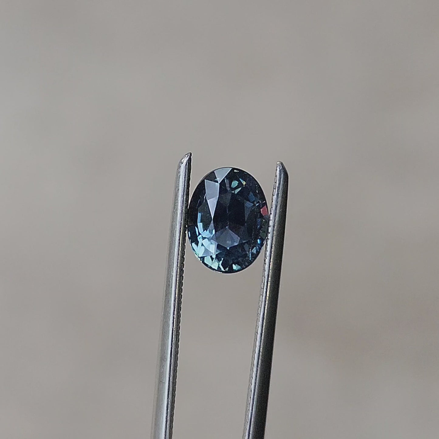 Load and play video in Gallery viewer, 1.28 Natural Teal Blue Sapphire Oval
