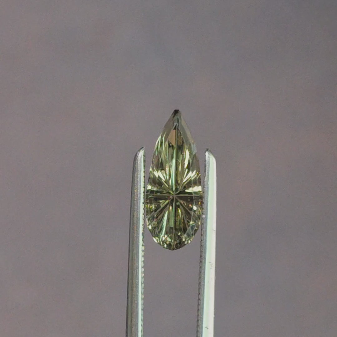Load and play video in Gallery viewer, .84ct Natural Australian Sapphire Green Yellow Starbrite Pear Cut by John Dyer
