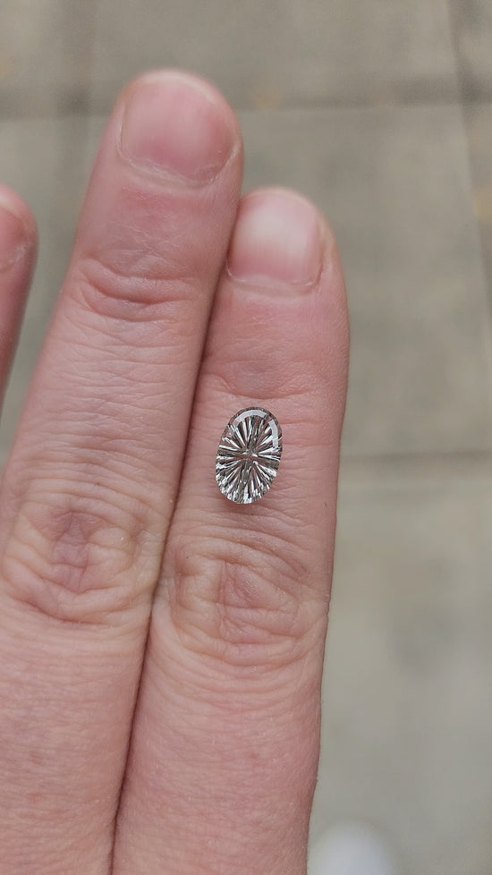 Load and play video in Gallery viewer, 1.50ct Natural Pale Green Oval Montana Sapphire - Starbrite Cut by John Dyer
