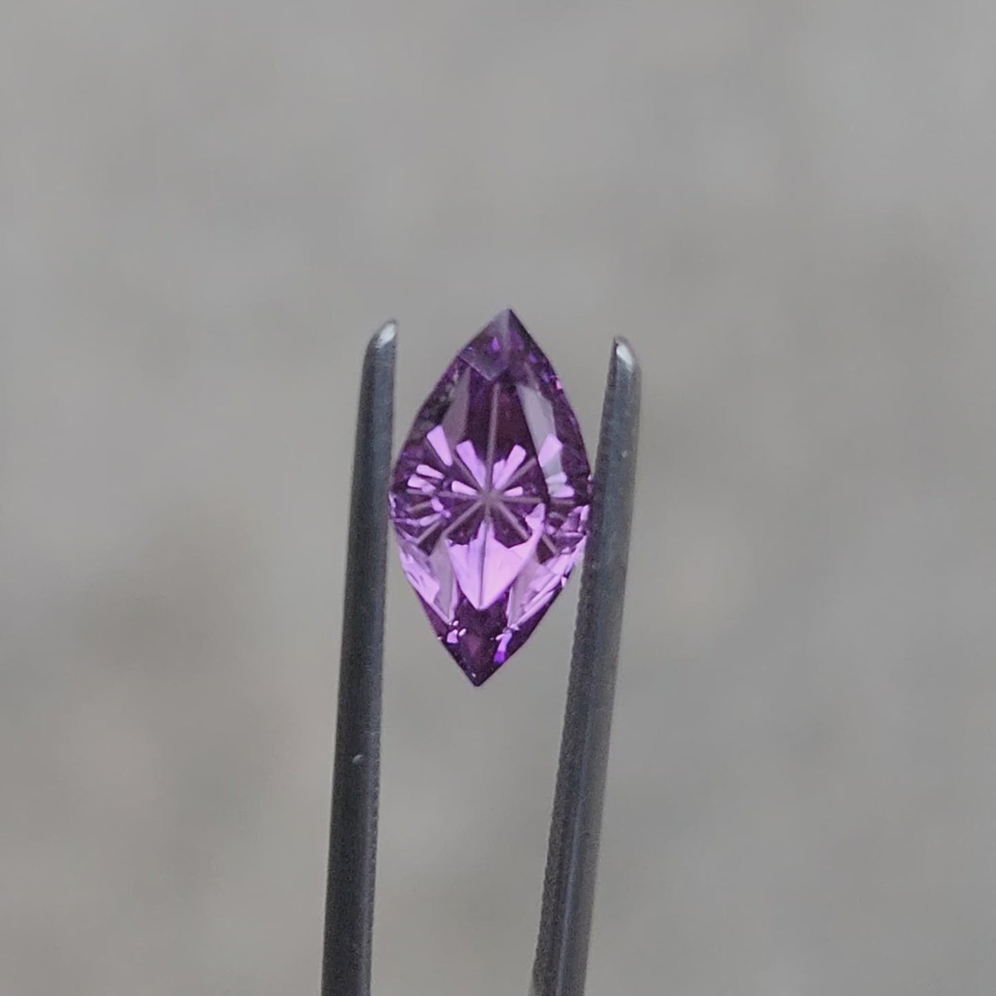 Load and play video in Gallery viewer, 1.66ct Lab Grown Purple Sapphire Marquise Fantasy Cut by The Fellowship Forge
