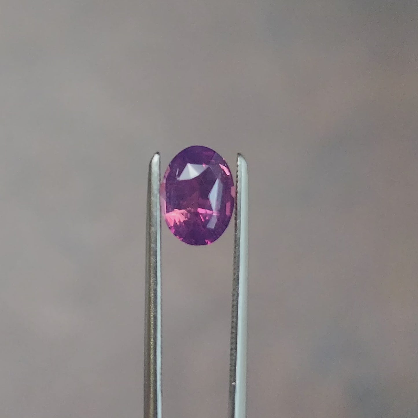 Load and play video in Gallery viewer, natural purple pink oval sapphire from Sri Lanka

