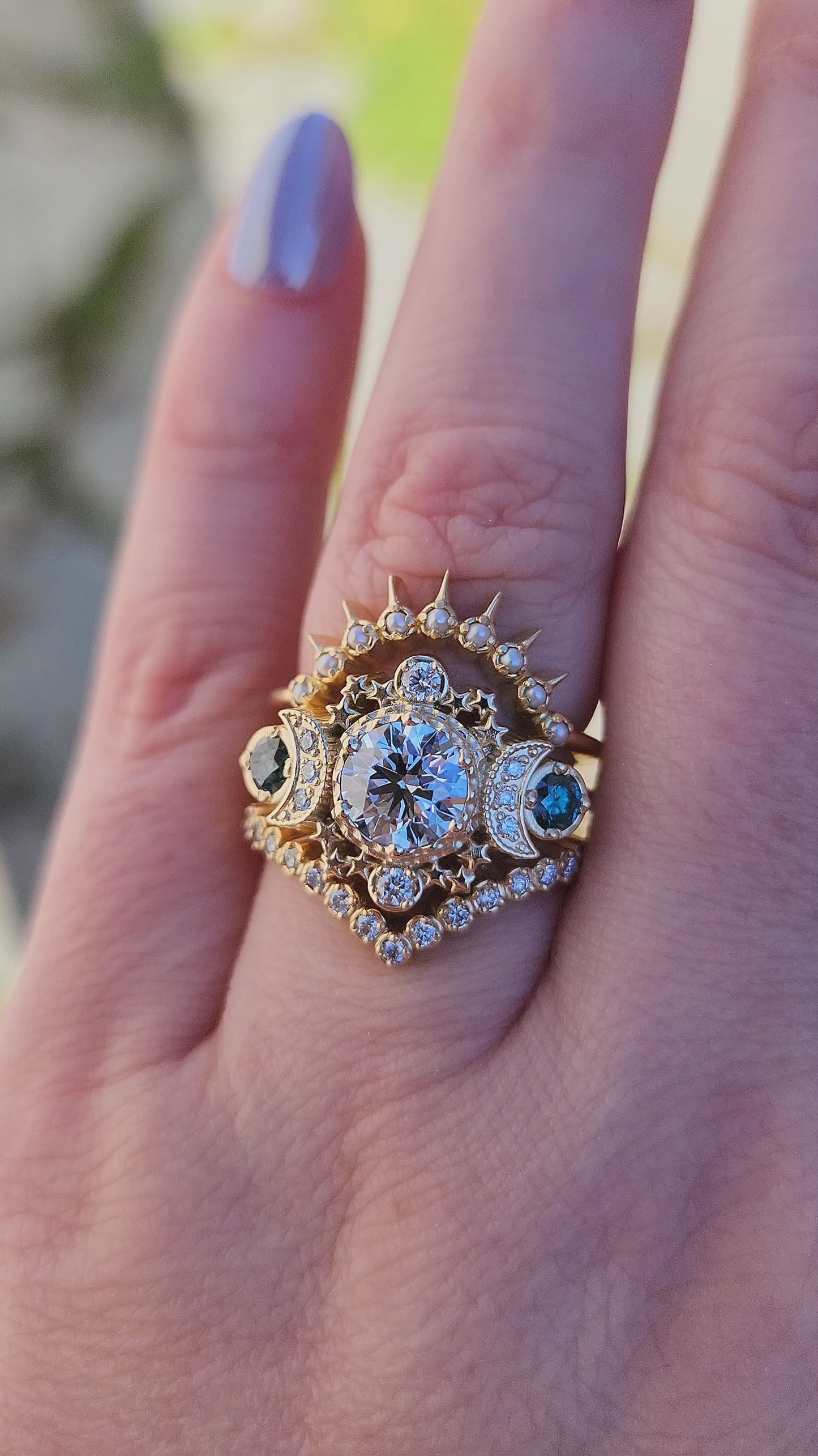 Load and play video in Gallery viewer, Blue diamond Cosmos moon ring with stars and pearl sunray wedding band and pave diamond chevron side band 14k yellow gold video
