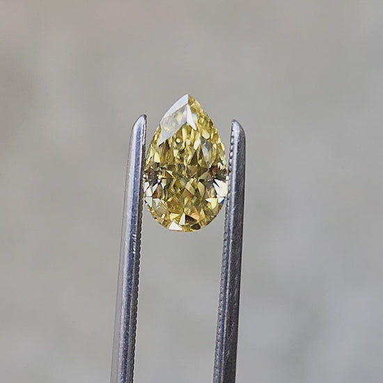 Load and play video in Gallery viewer, .93ct 8x5mm Yellow Moissanite Pear
