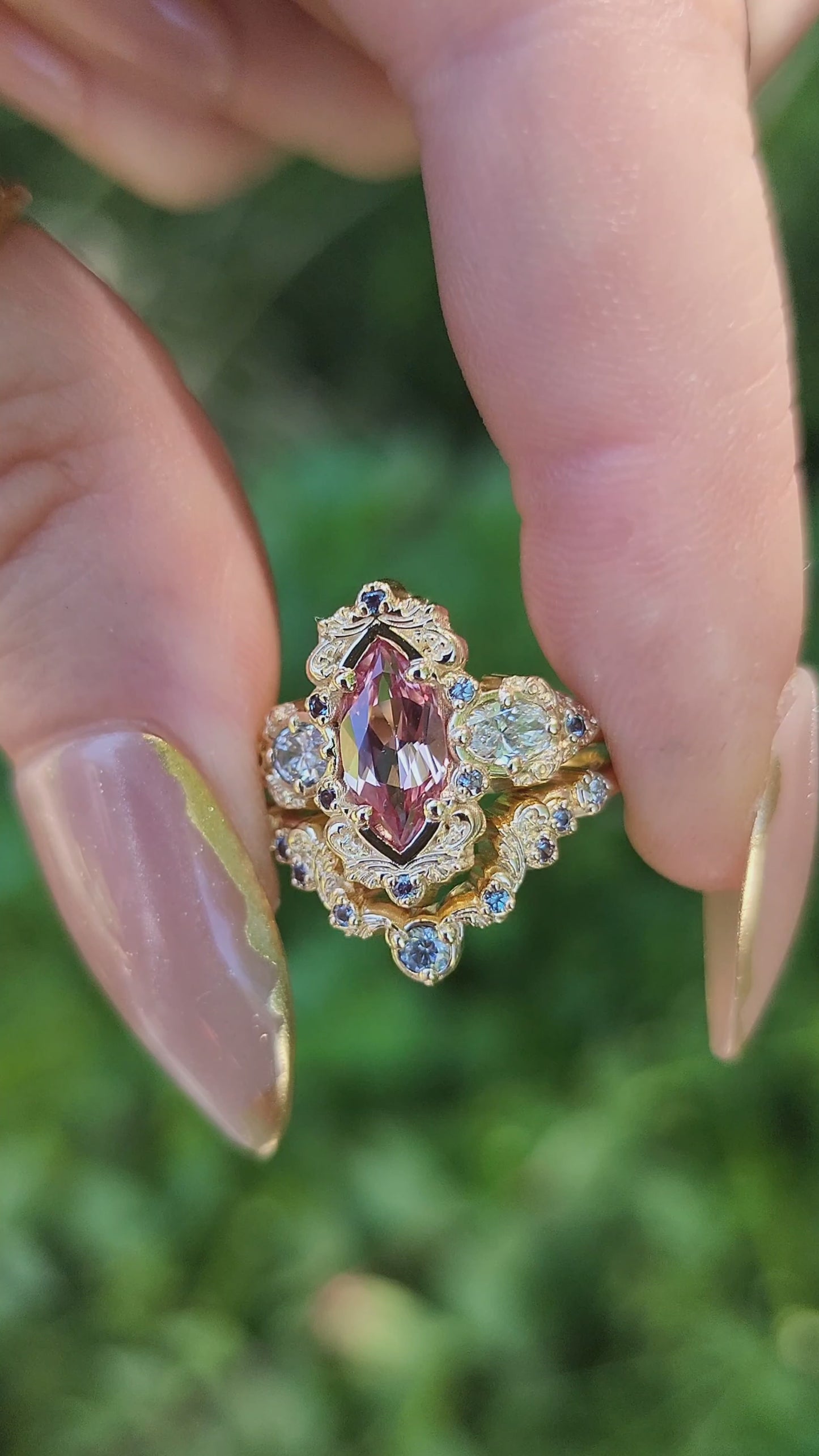 Load and play video in Gallery viewer, Chatham Peachy Pink Champagne Sapphire Josephine Engagement Ring Set with Oval Side Stones 14k Yellow Gold with color change Alexandrite Accents unique fairytale ring video 1
