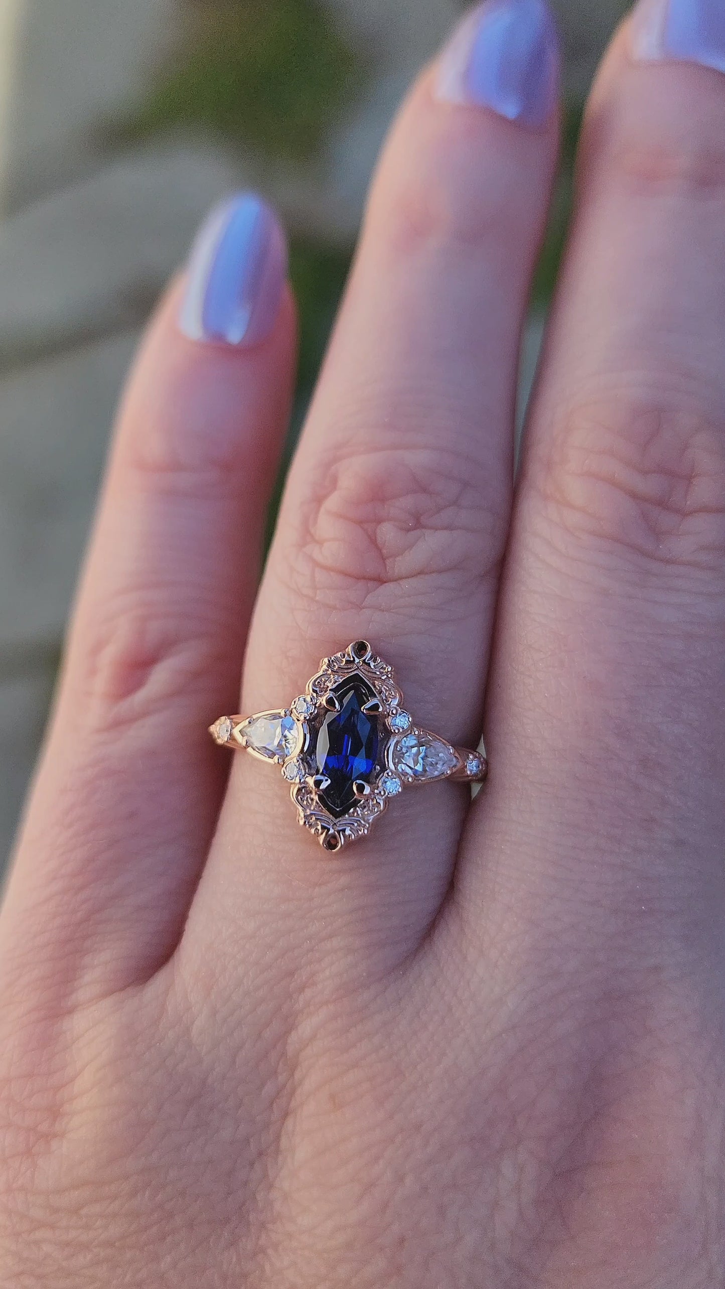 Load and play video in Gallery viewer, Rose gold filigree ring with a blue sapphire marquise gemstone in a blue velvet box video
