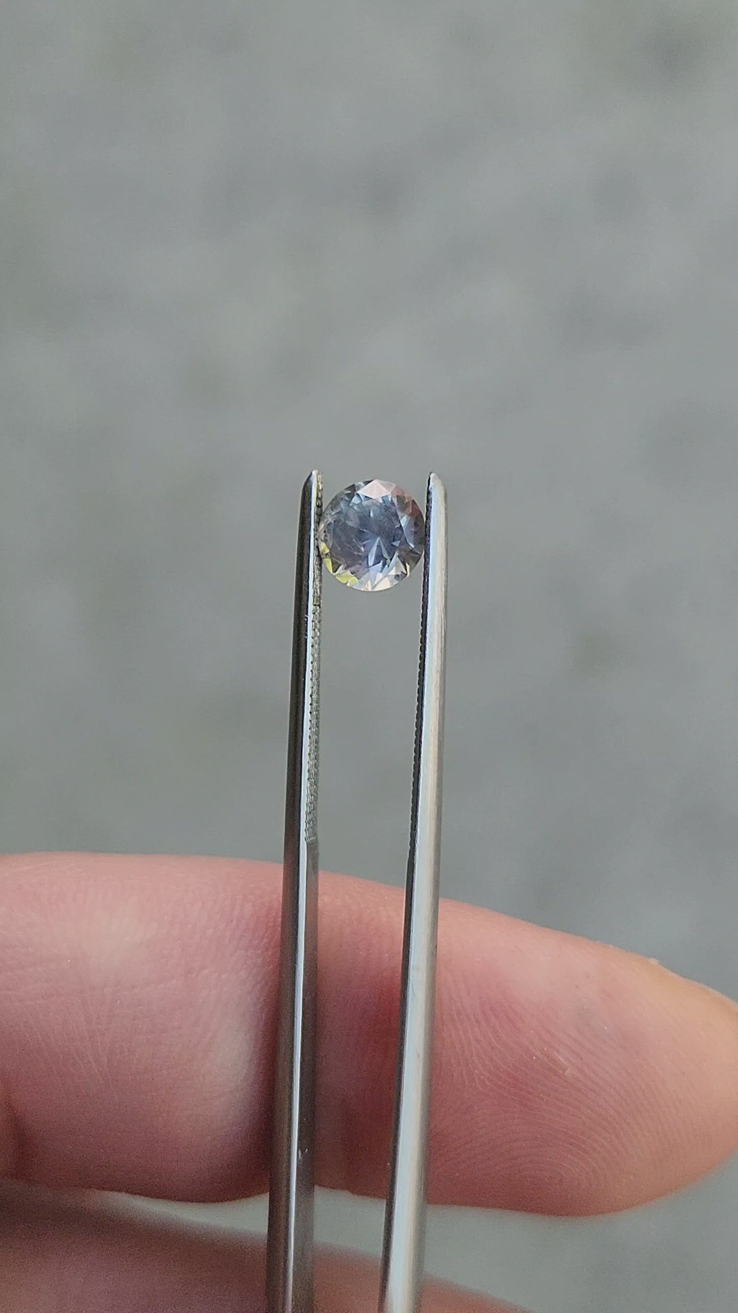 Load and play video in Gallery viewer, .71ct Round Cut Natural Montana Sapphire Light Color Change

