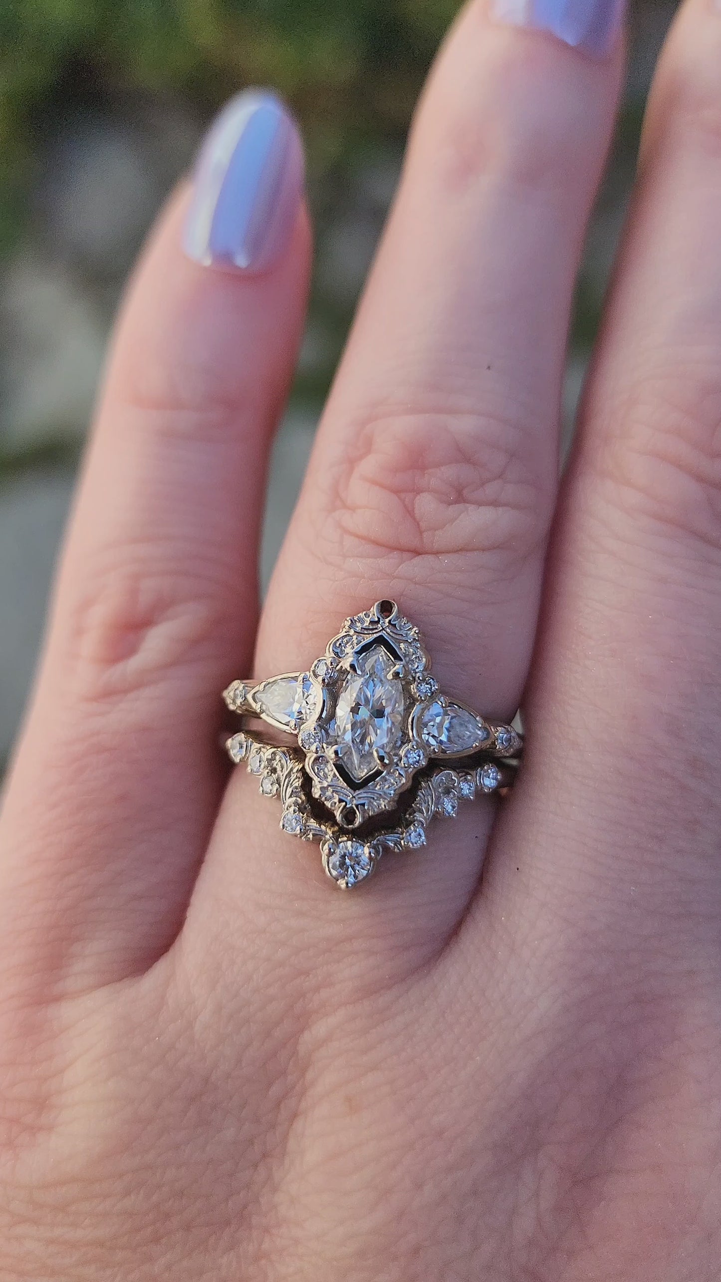 Load and play video in Gallery viewer, Marquise moissanite and pear engagement ring set with filigree antique scroll details in 14k white gold video
