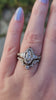 Marquise moissanite and pear engagement ring set with filigree antique scroll details in 14k white gold video