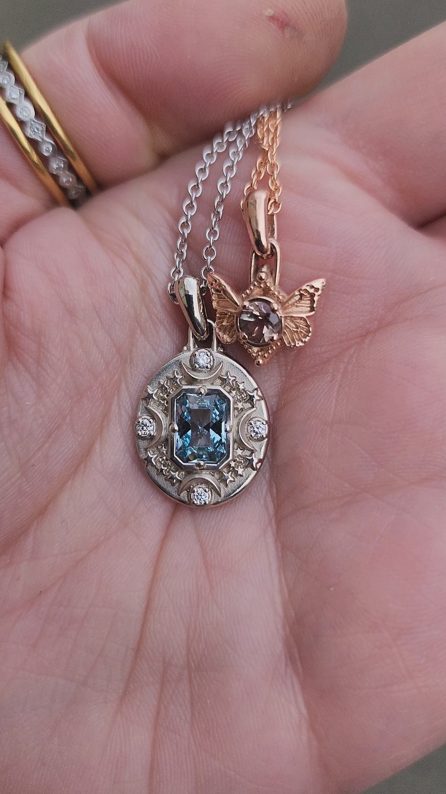 Load and play video in Gallery viewer, White gold aquamarine Artemis pendant and oregon sunstone butterfly pendant rose gold video
