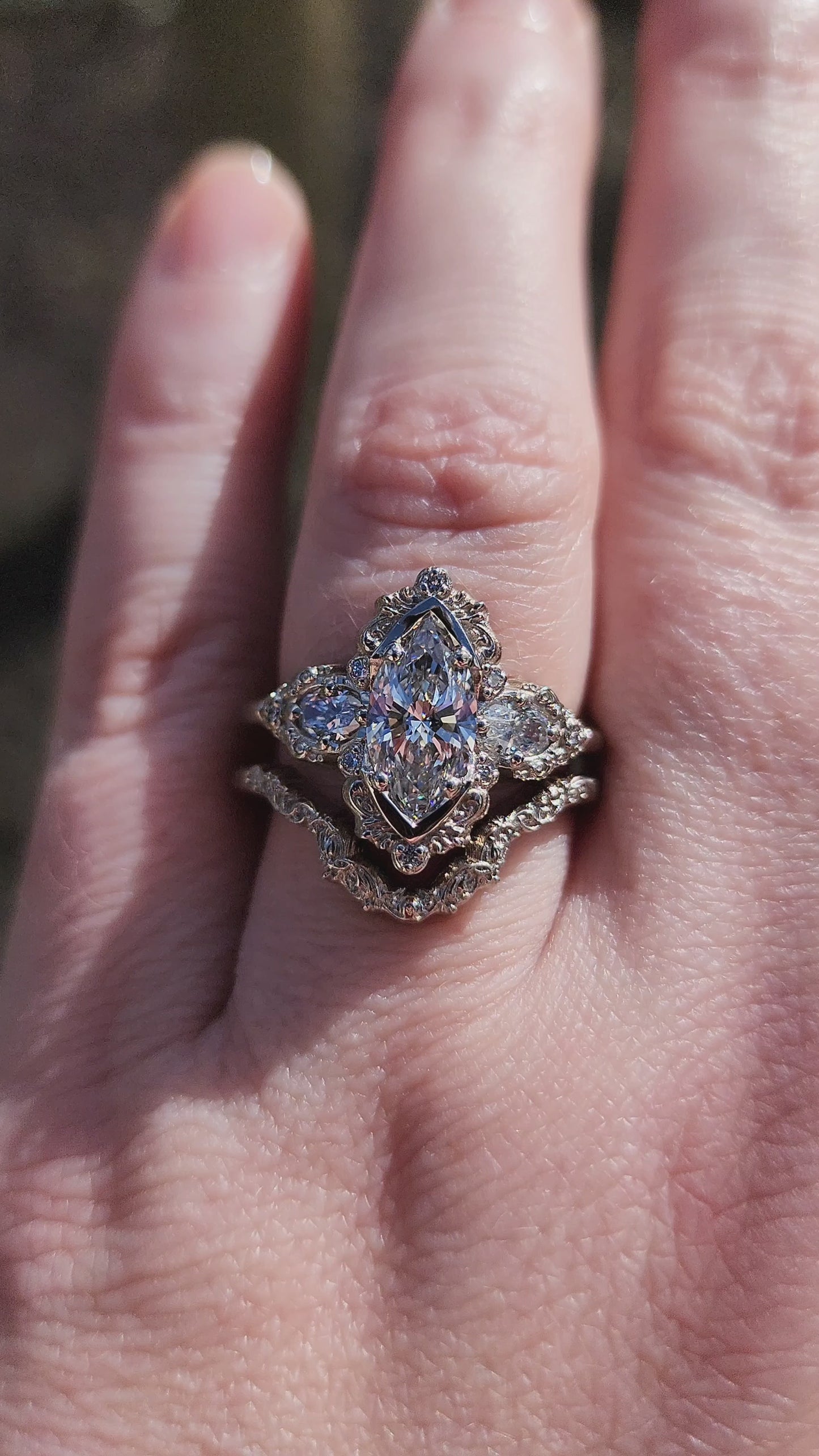 Load and play video in Gallery viewer, Josephine Filigree Wedding Ring Set with a 1.27ct E/VVS2 Marquise Lab Diamond video
