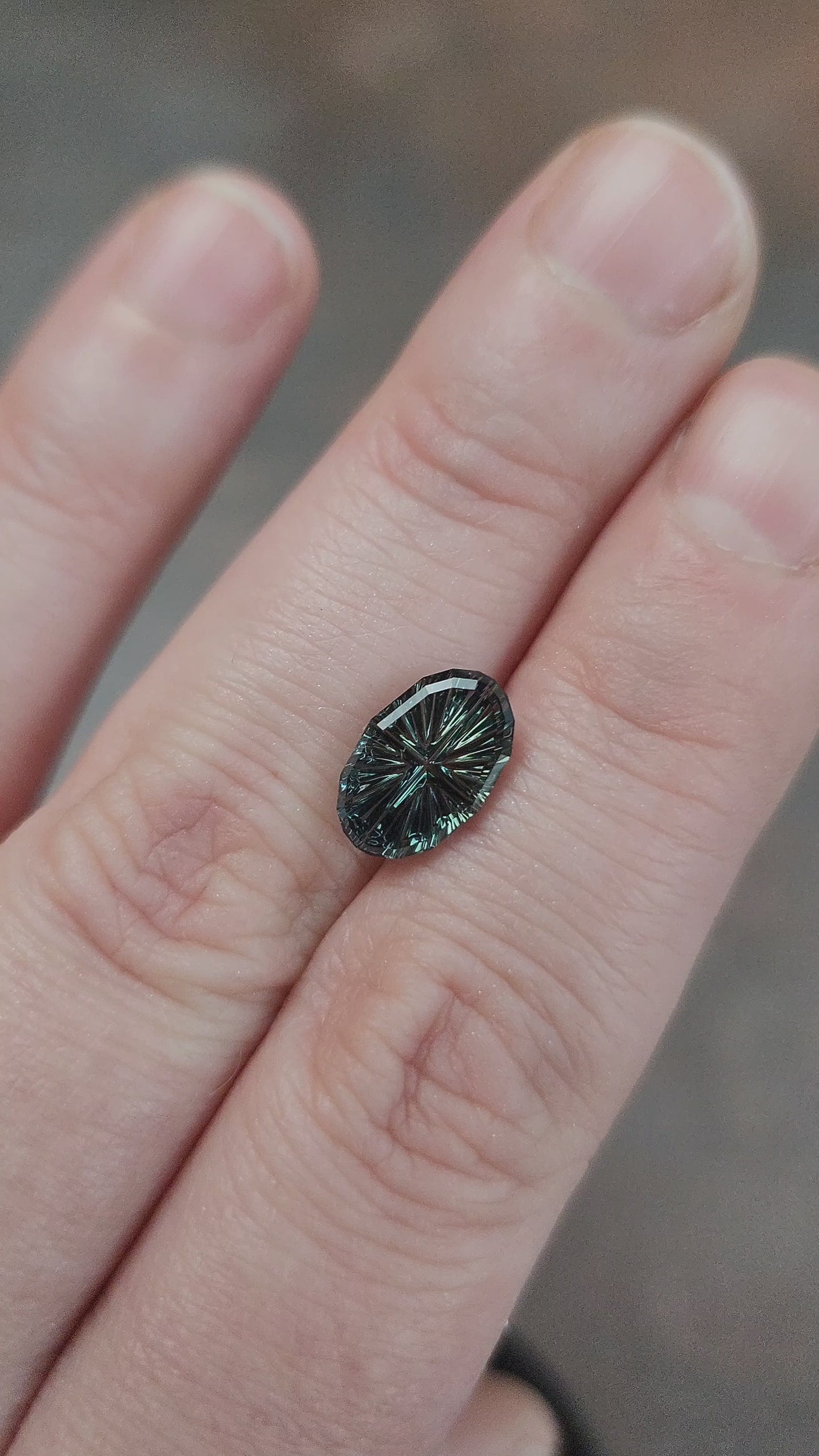 Load and play video in Gallery viewer, 2.74ct Color Shift Blue Green Sapphire Oval Fantasy Cut by Brett Kosnar
