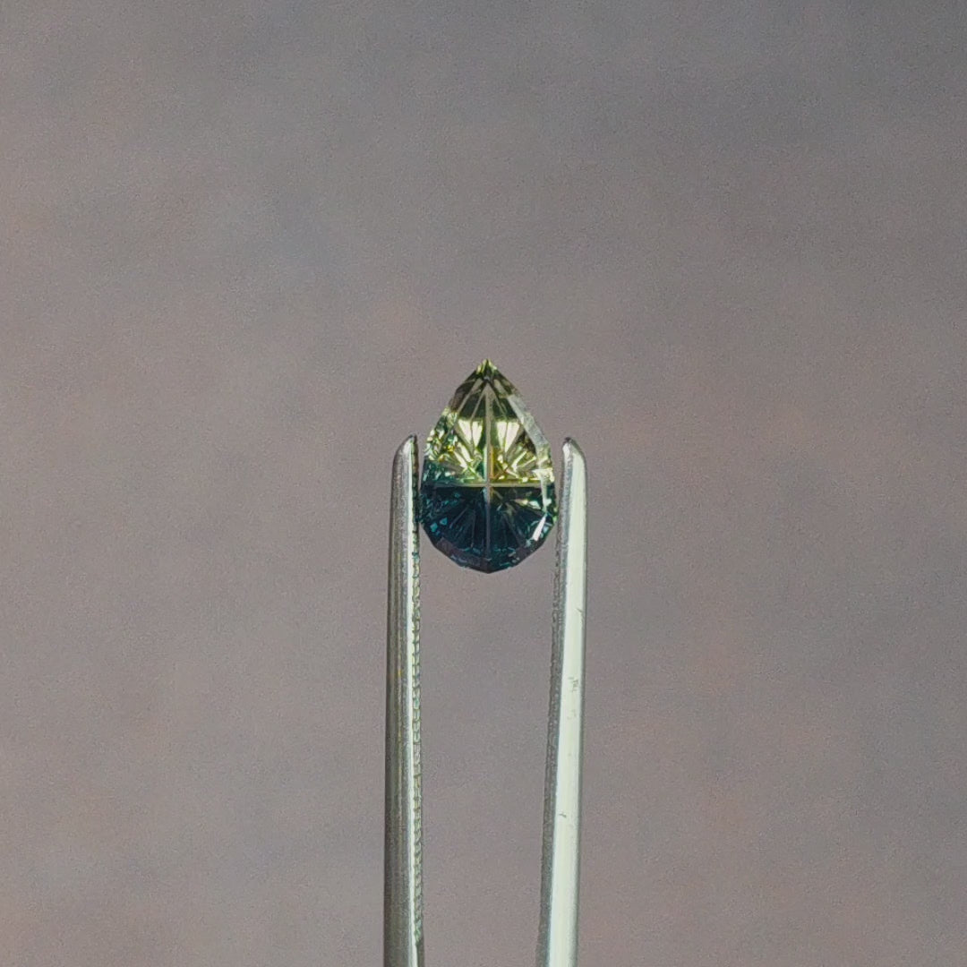 Load and play video in Gallery viewer, .86ct Parti Natural Australian Sapphire Pear Fantasy Cut by Brett Kosnar
