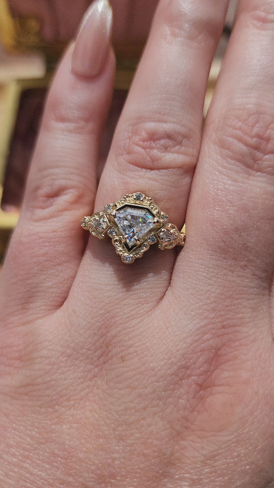 Load and play video in Gallery viewer, Odessa Art Deco Engagement Ring with Kite Side Stones and Delicate Gold Scrolls video 3
