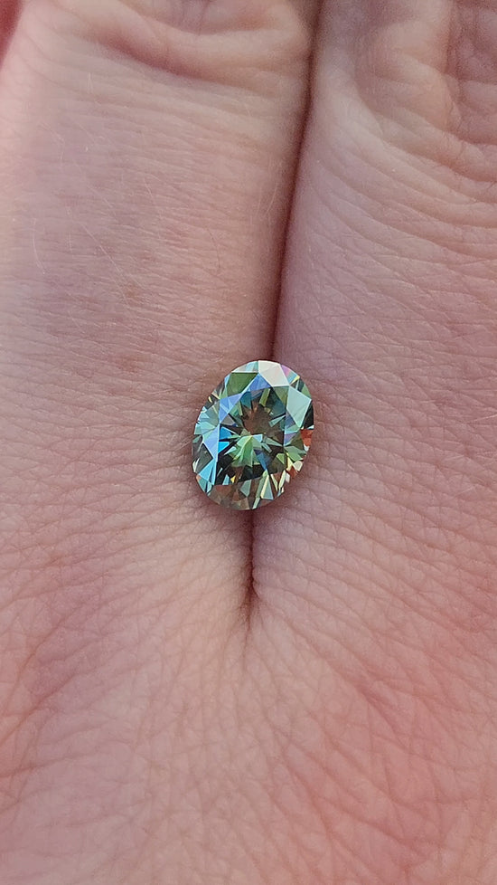 Load and play video in Gallery viewer, 1.40ct Oval Teal Moissanite 8x6mm
