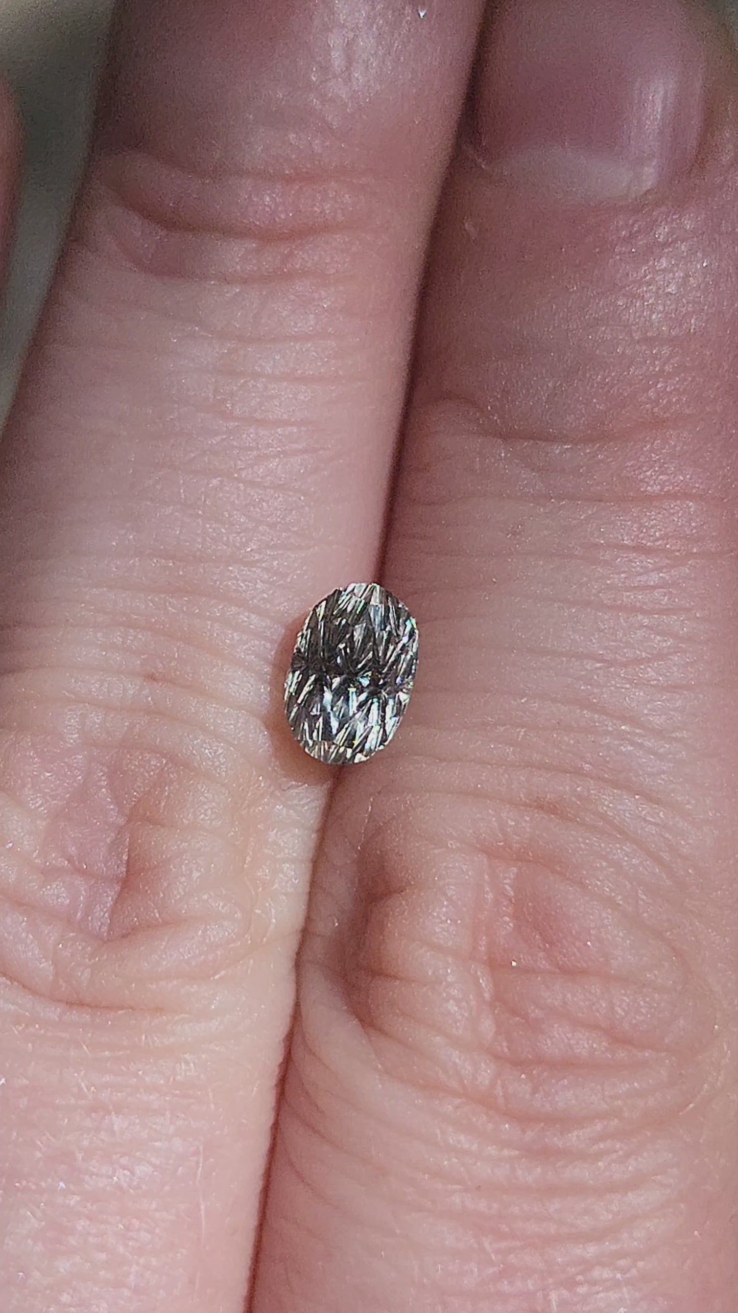 Load and play video in Gallery viewer, 1.44ct Natural Yellow Green Montana Sapphire Oval - Deep Concave Cut by John Dyer
