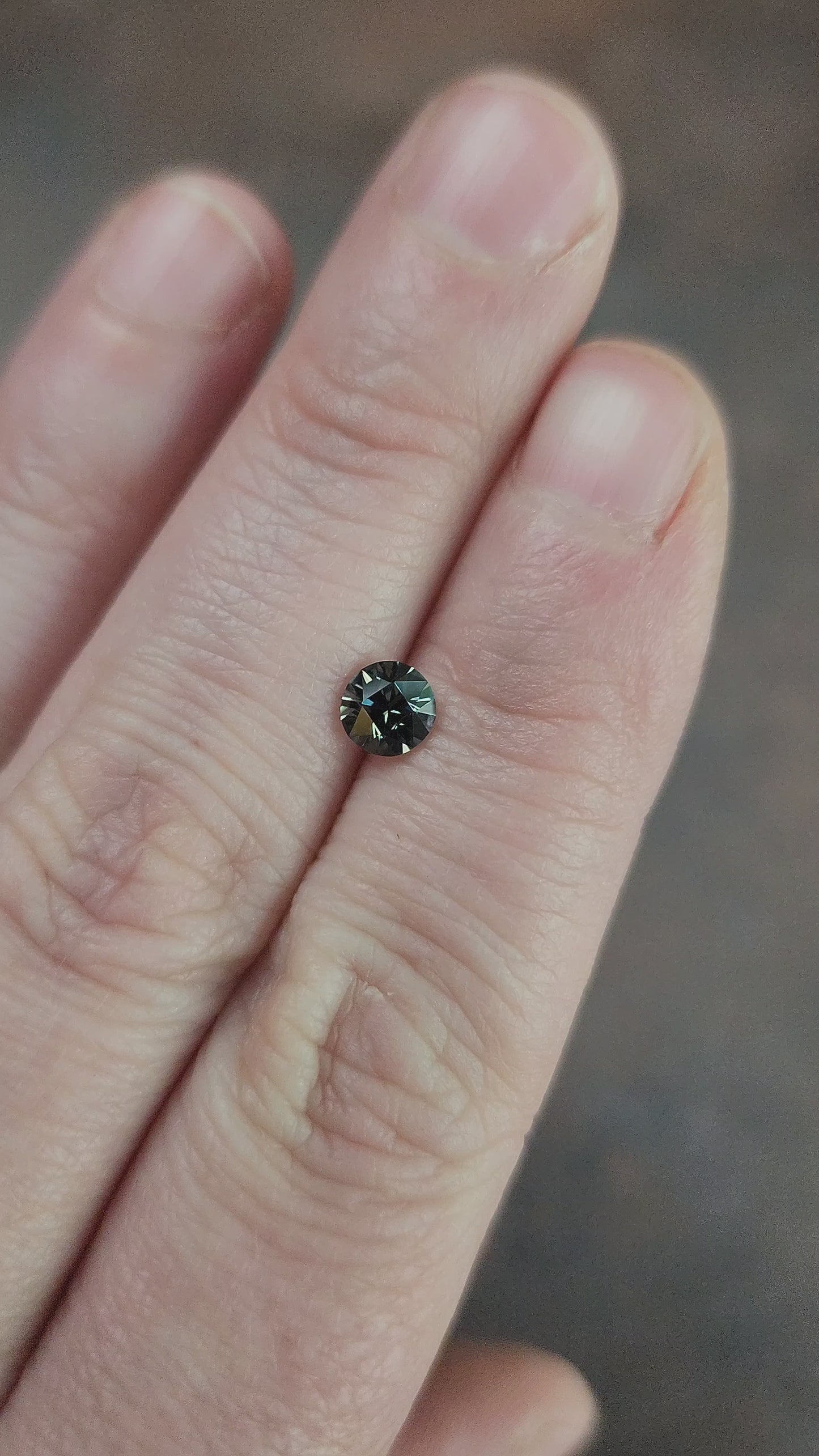 Load and play video in Gallery viewer, .68ct Natural Sapphire Blue Green Round
