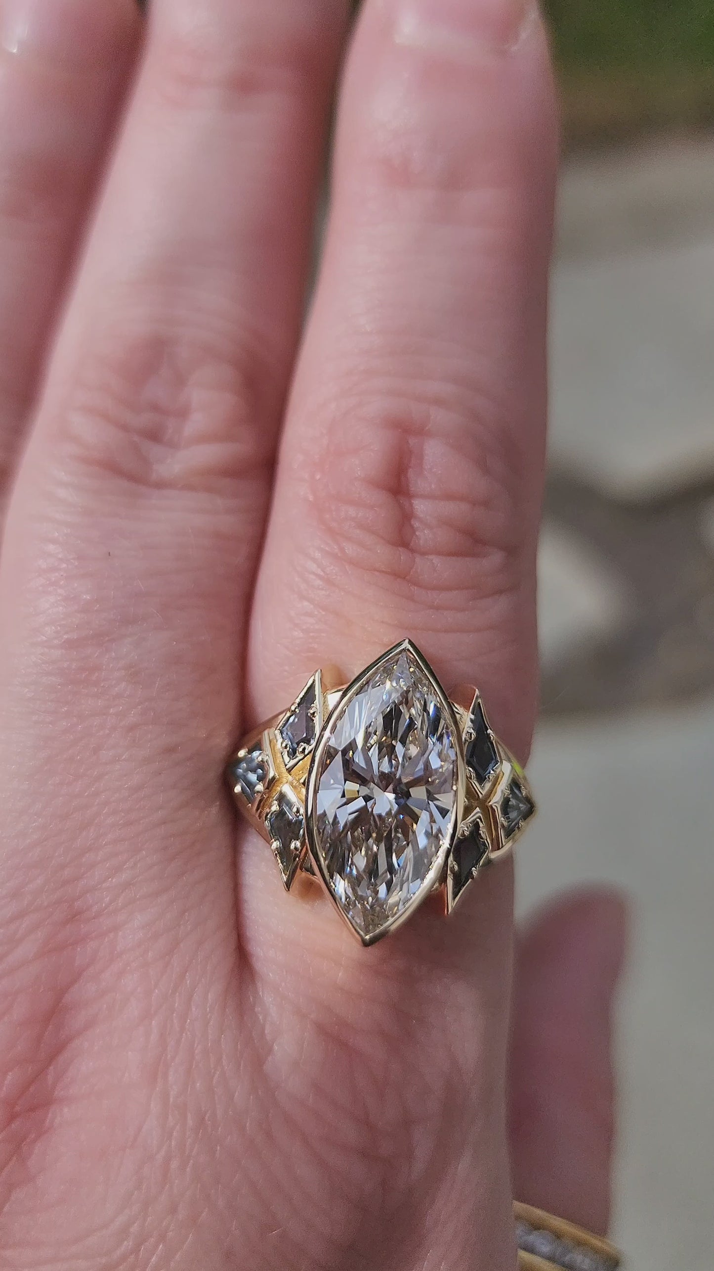 Load and play video in Gallery viewer, Valkyrie 4.28ct Marquise Diamond Ring with Montana Sapphire Kites 14k yellow gold video 1
