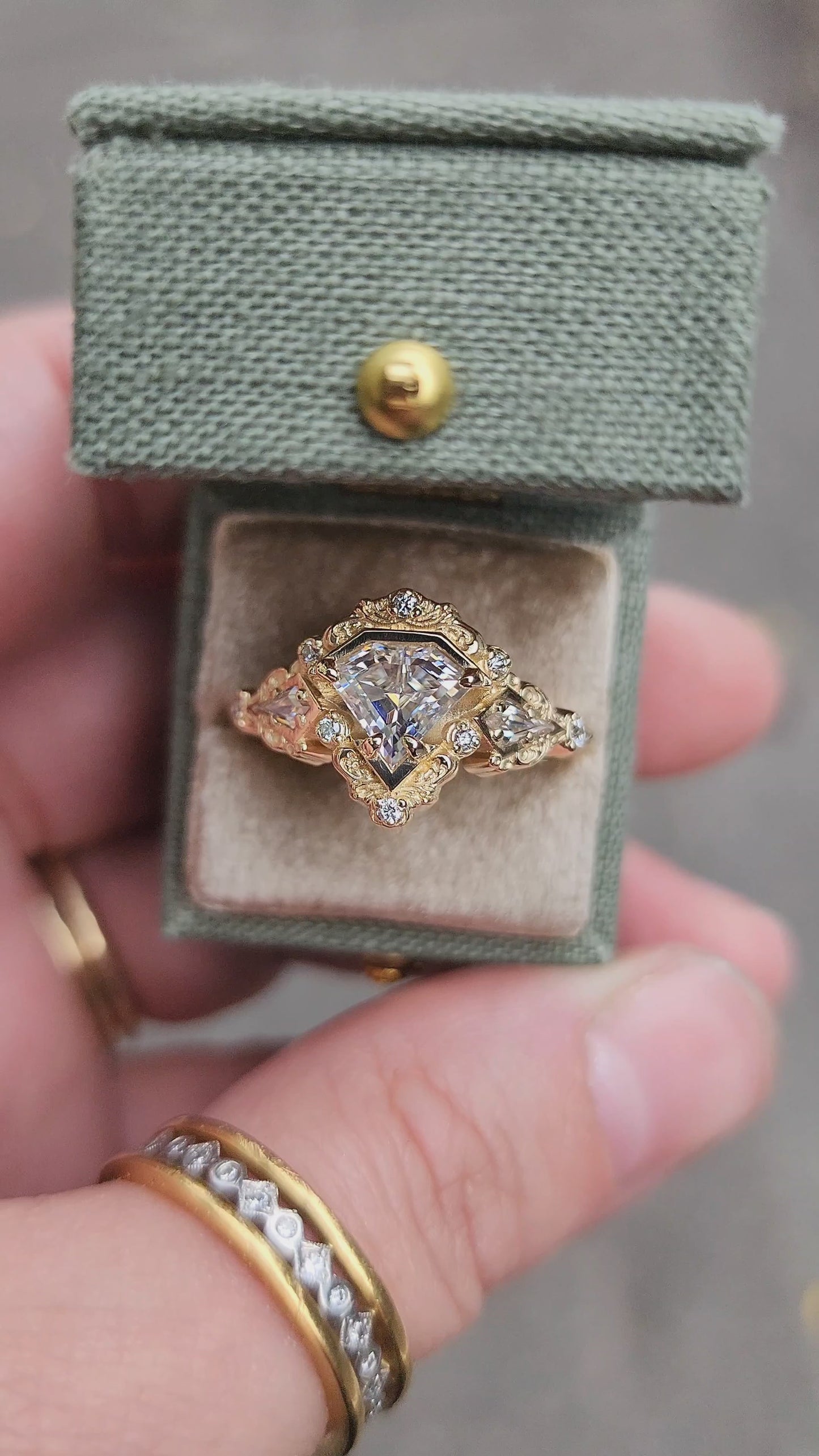 Load and play video in Gallery viewer, Odessa Art Deco Engagement Ring with Kite Side Stones and Delicate Gold Scrolls video 2
