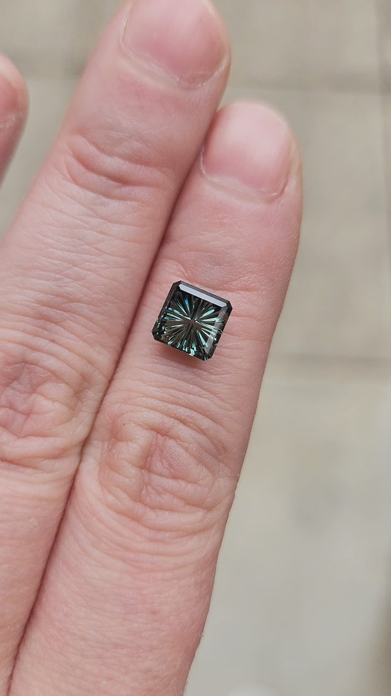 Load and play video in Gallery viewer, 1.62ct Natural Teal Australian Square Sapphire - Starbrite Cut by John Dyer
