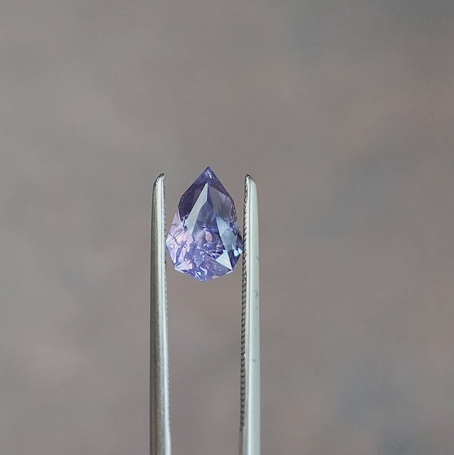 Load and play video in Gallery viewer, natural geometric step cut purple pear sapphire from Sri Lanka
