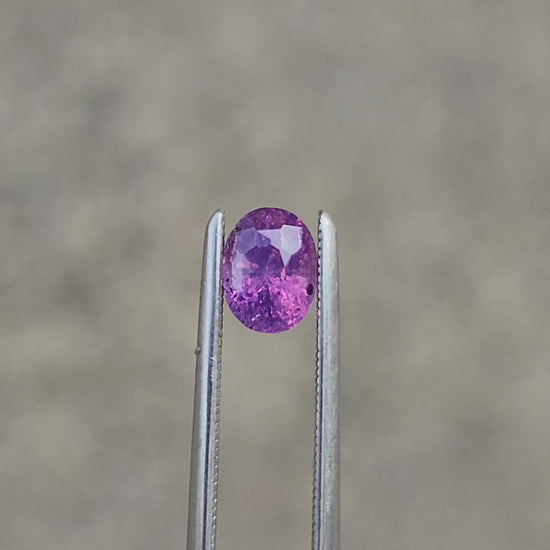 Load and play video in Gallery viewer, .85 Natural Opalescent Bi Color Purple Pink Sapphire Oval
