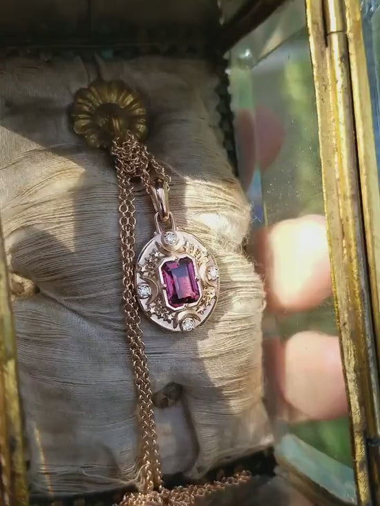 Load and play video in Gallery viewer, Artemis Pendant with Emerald Cut Rhodolite Garnet and Diamonds - 14k Rose Gold Handmade Jewelry with Crescent Moon &amp;amp; Stars
