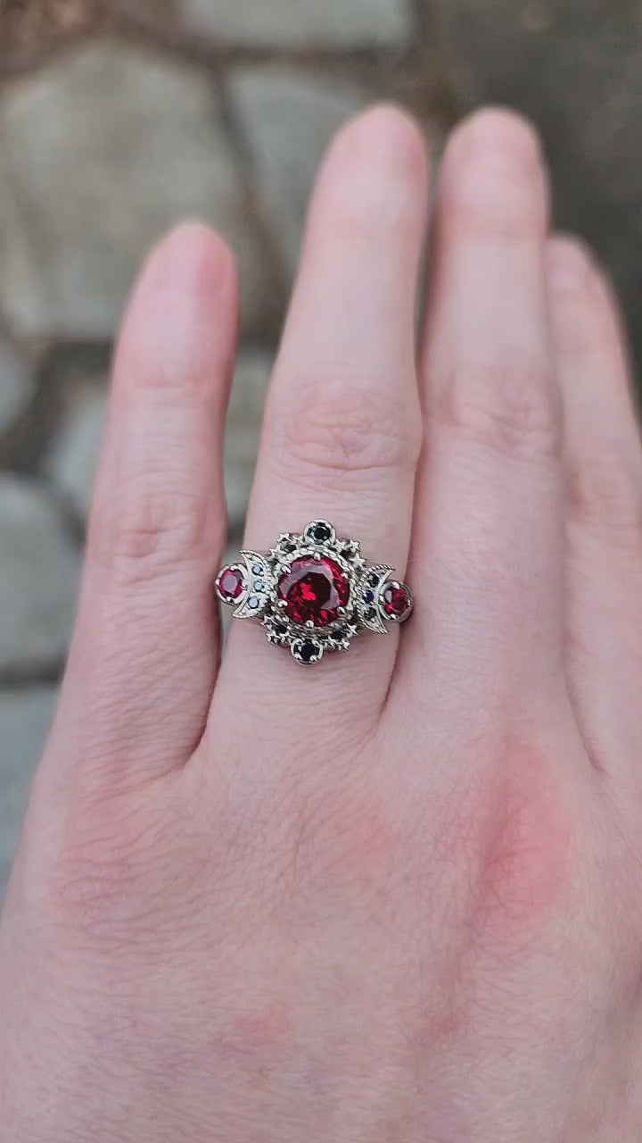 Load and play video in Gallery viewer, Blood Moon Chatham Ruby Engagement Ring with Black Diamonds Cosmos Gothic Triple Moon Wedding Ring - 14k Palladium Gold
