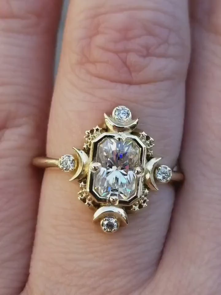 Load and play video in Gallery viewer, Emerald Cut Artemis Moon Engagement Ring with Radiant Cut Moissanite - Celestial Goddess Engagement
